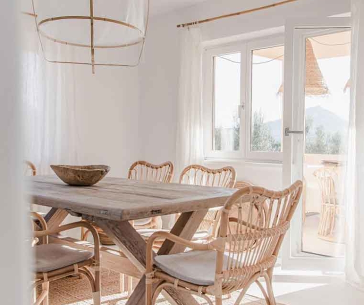 Boho-Scandi Rattan Dining Chairs to Create a Rustic Modern Table Set