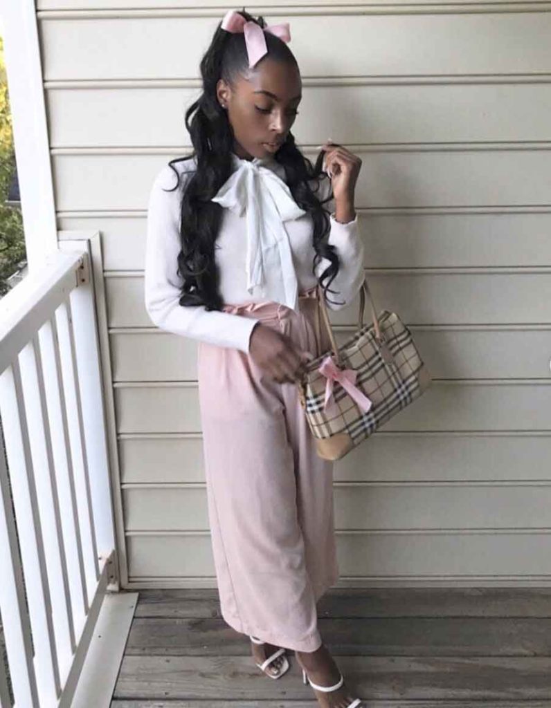 https://www.themoodguide.com/wp-content/uploads/2021/11/girly-outfits-pants-black-girl-796x1024.jpg