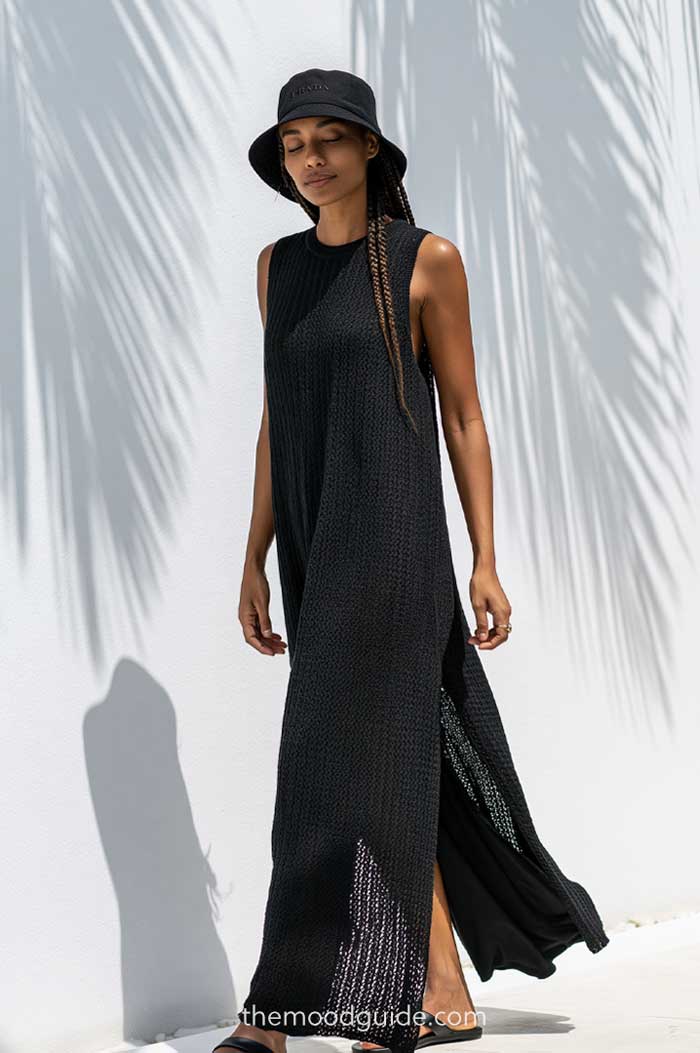 maxi knit all black chic cover up outfit with minimal modern chic simple black prada bucket hat for summer resort vacation quiet luxury style