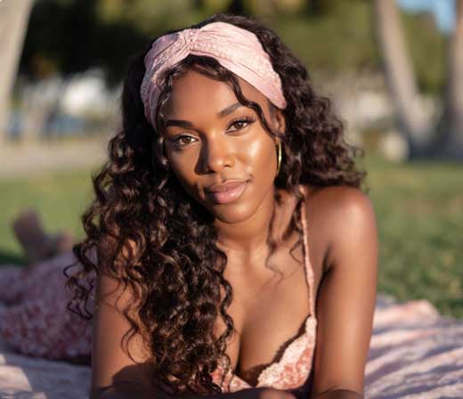 long curly cottagecore hairstyle for black woman