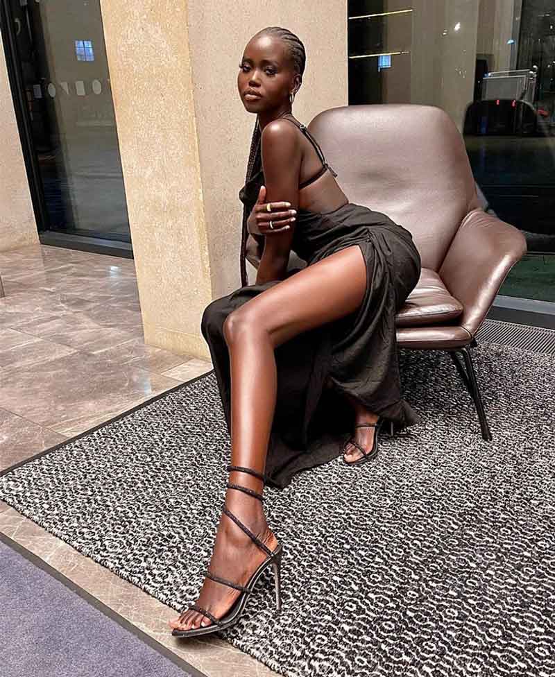 https://themoodguide.com/wp-content/uploads/2022/07/black-strappy-stilleto-heels.jpg