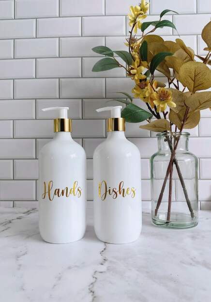 Set of 2 White Soap Dispensers with gold writing and pump cap