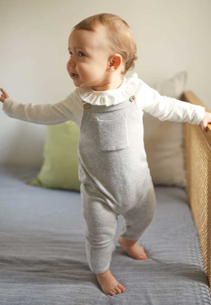 Long knitted dungarees neutral grey baby onesies