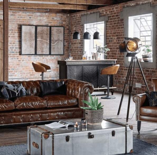 brown-chesterfield-distressed-leather-sofa-industrial-living-room-brick-wall
