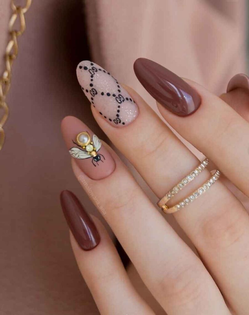 brown gucci nail design