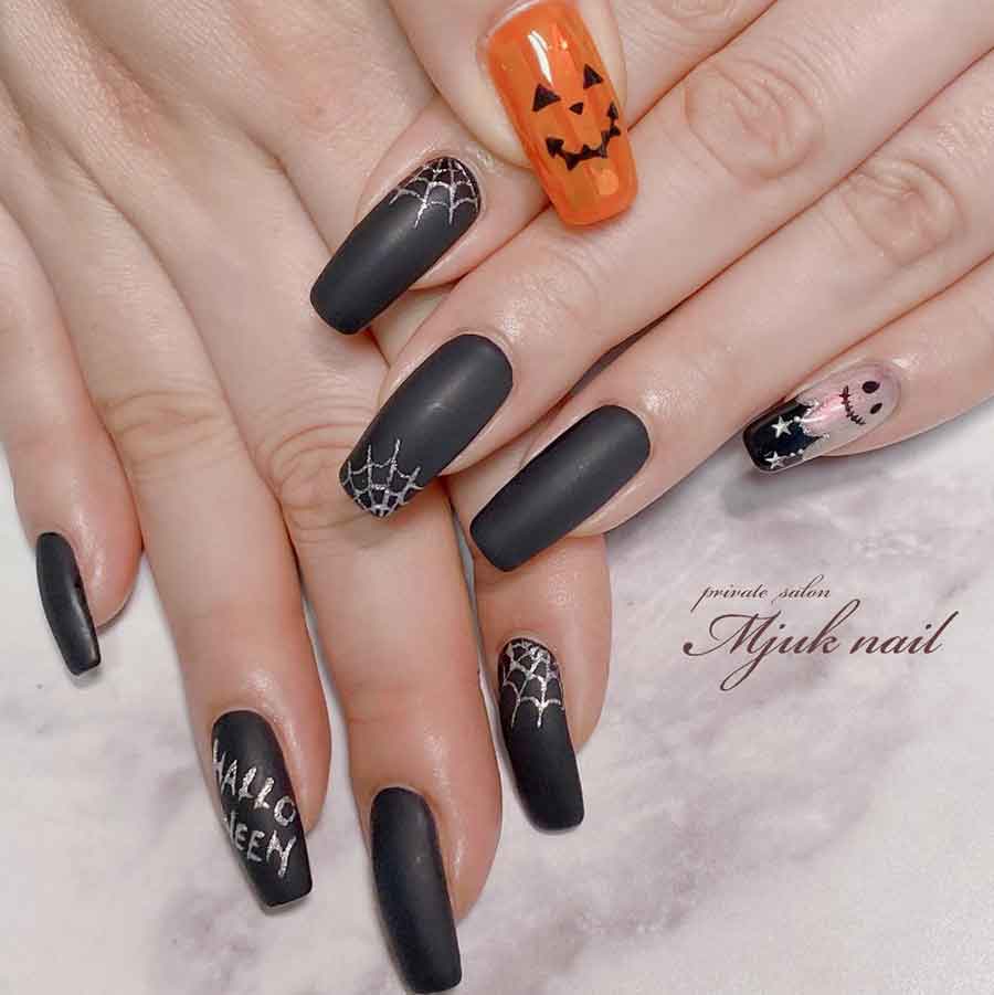 black and orange halloween nails