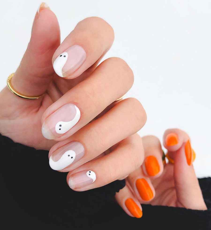 white and orange halloween nails