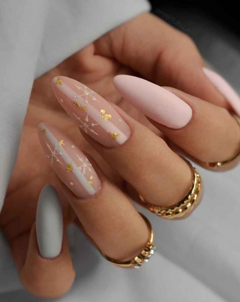 blush pink and gold long almond christmas nails