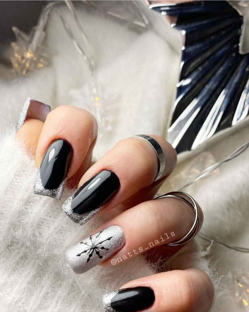 black and silver snowflake nails