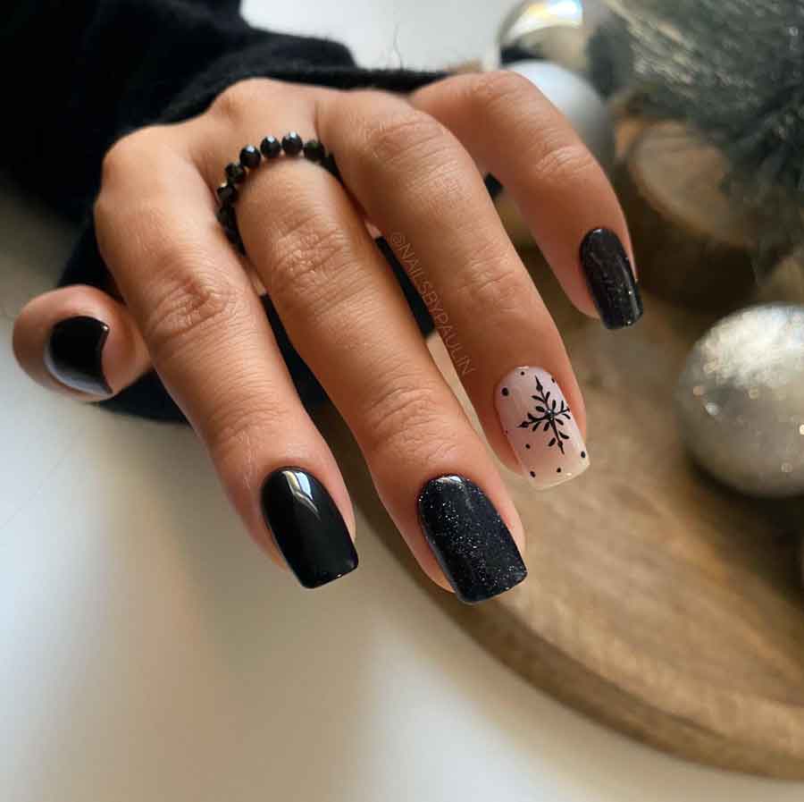 black and nude snowflake winter nails