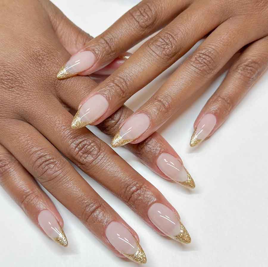gold winter nails black hands