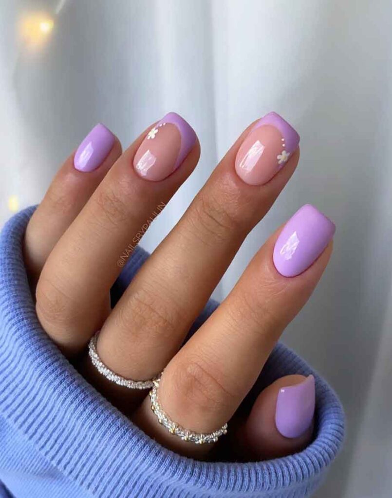 Close up womans hands with matte lavender nail design on purple background  Stock Photo - Alamy