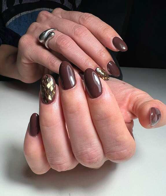 dark brown long nails with Gold plaques