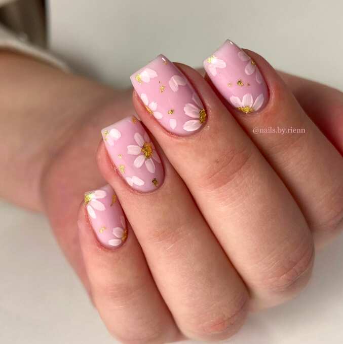 long square nails with pink white and gold floral nail art