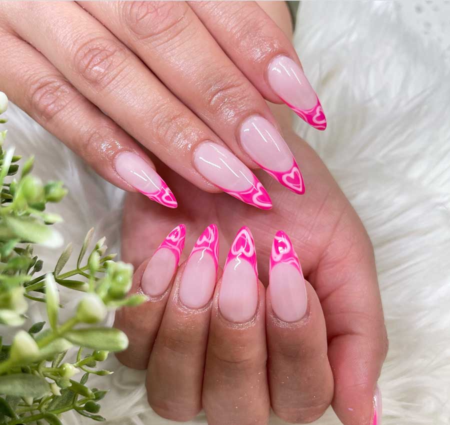 Hot pink stiletto french tips with soft pink hearts