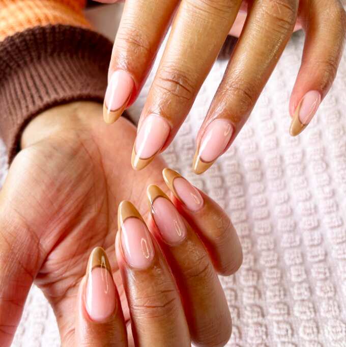 Chic French tips brown long almond nails