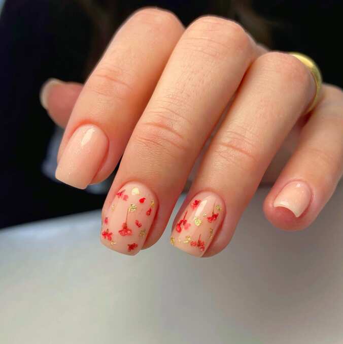short square nails with sophisticated orange and gold poppy flower nail art