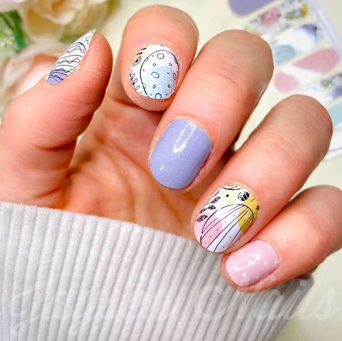 short round nails with lavender pink black easter art