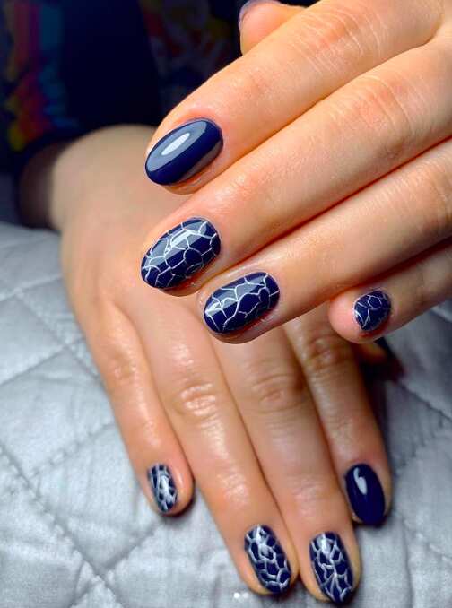 oval short navy blue nails with mosaic design
