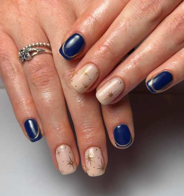 short square navy nails with gold stars