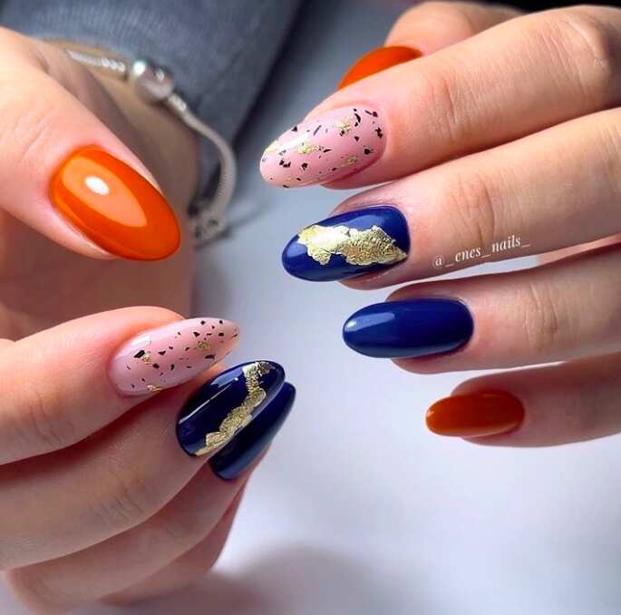 gold orange and navy blue long almond nails