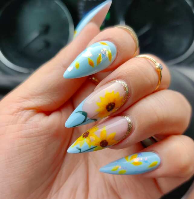 extra long coffin nails with blue pastel and sunflower art design
