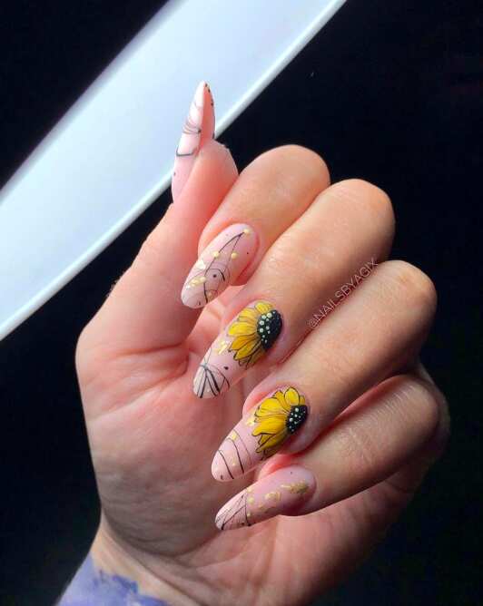 long oval nails with modern black and yellow sunflower art design