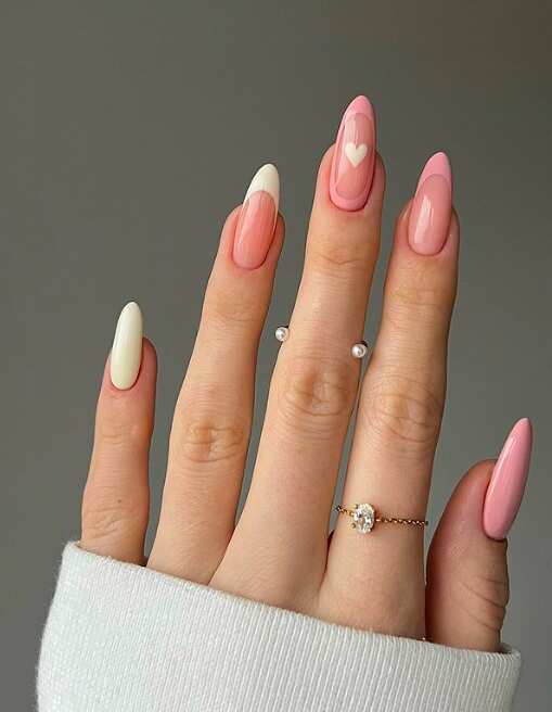 long oval nails with pink and white french tip and heart art
