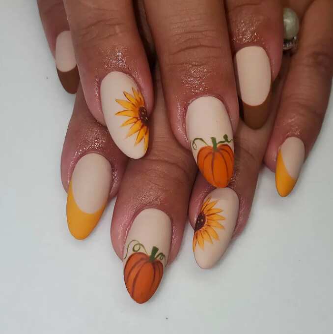 long oval nails with matte pumpkins and sunflowers art fall design