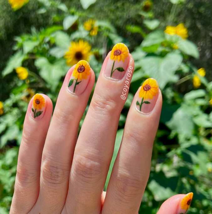 a single yellow sunflower art painted on every finger