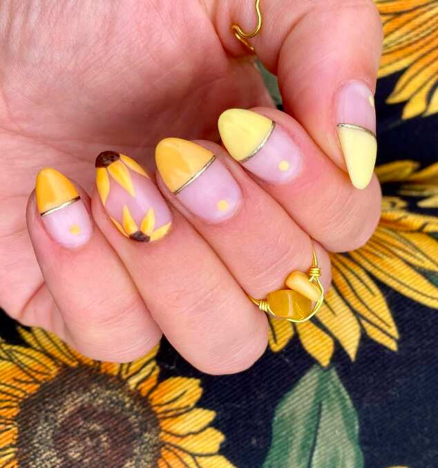almond nails with yellow ombré and sunflower design art