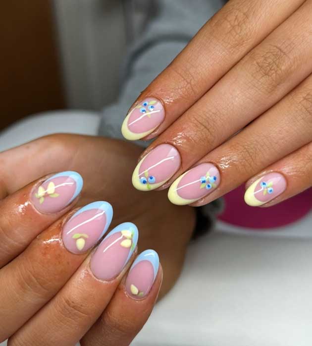 butter yellow and light blue spring nails with blueberry and lemon nail design on short oval nail