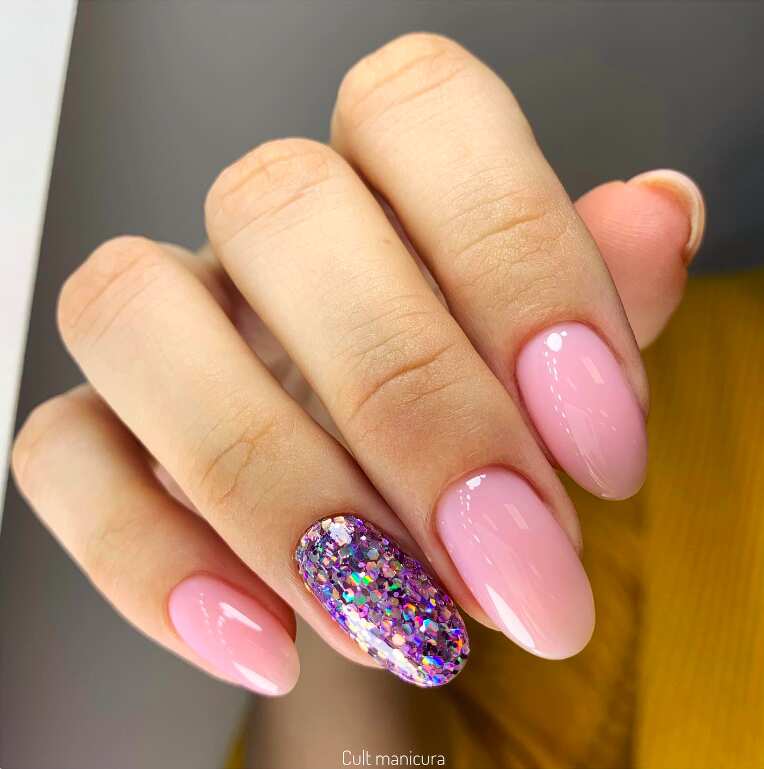 pink nails with purple glitter design