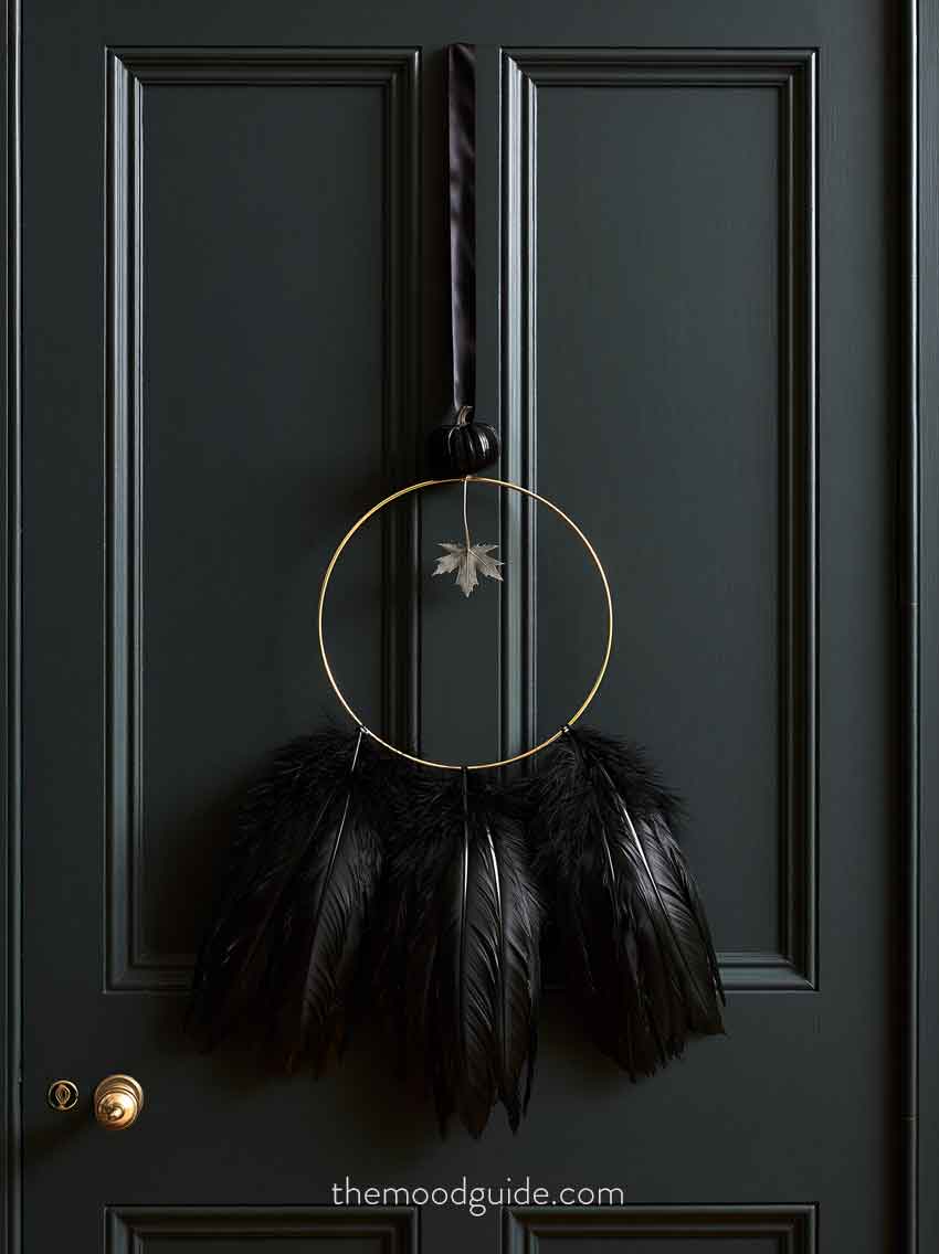 black and gold modern metal hoop fall wreath with black feathers