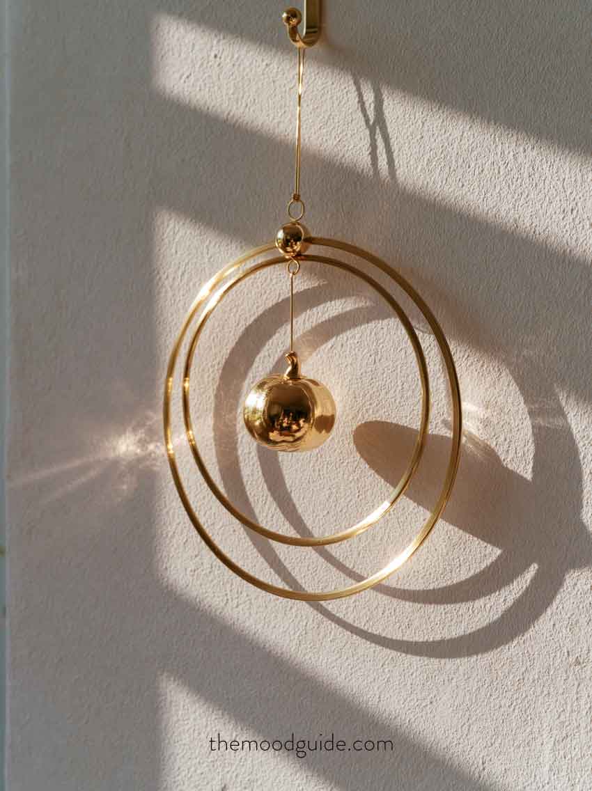 elegant chic modern minimalist fall wreath with metal ring and small gold pumpkin