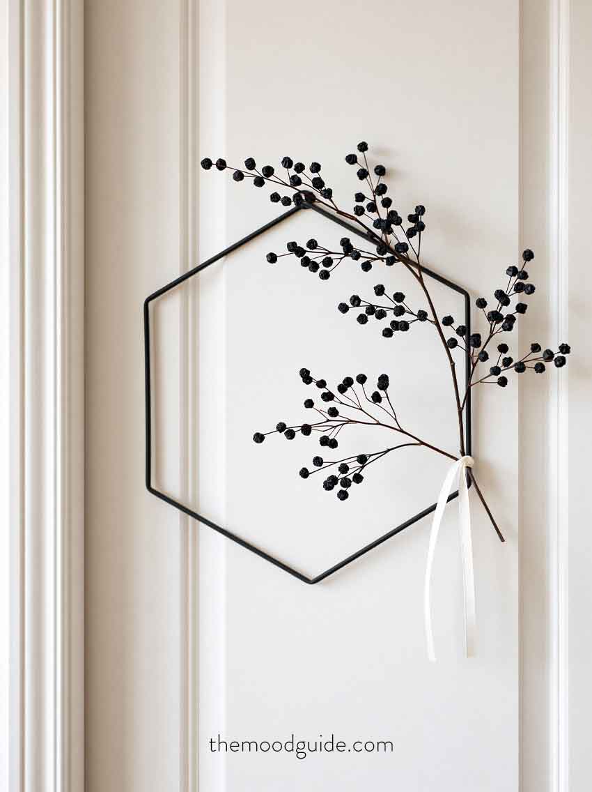 minimal aesthetic black and white fall wreath on white door