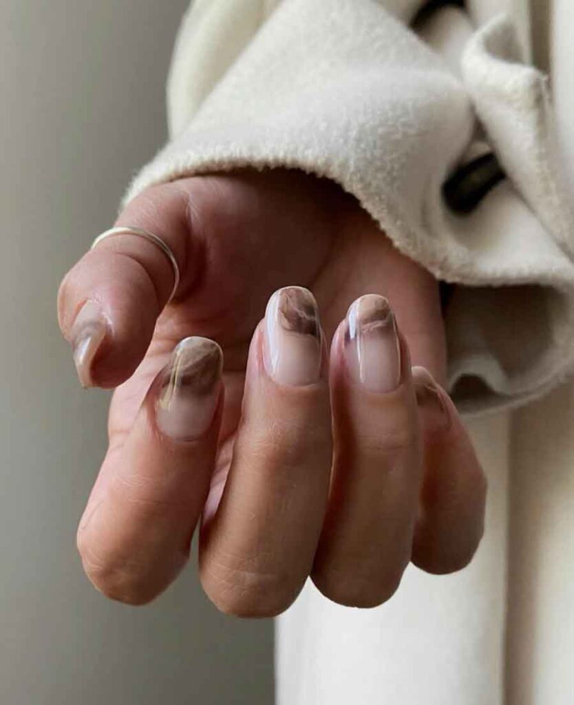 white and brown marble nails
