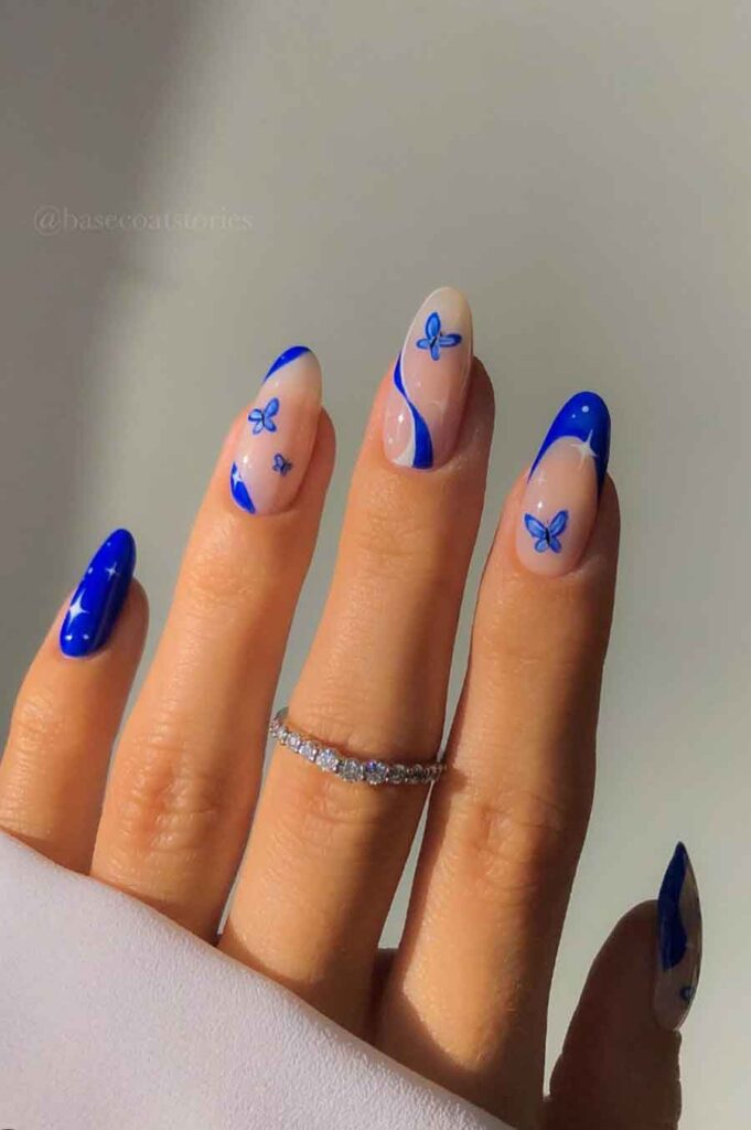 electric blue butterfly nail design for spring aesthetic manicure
