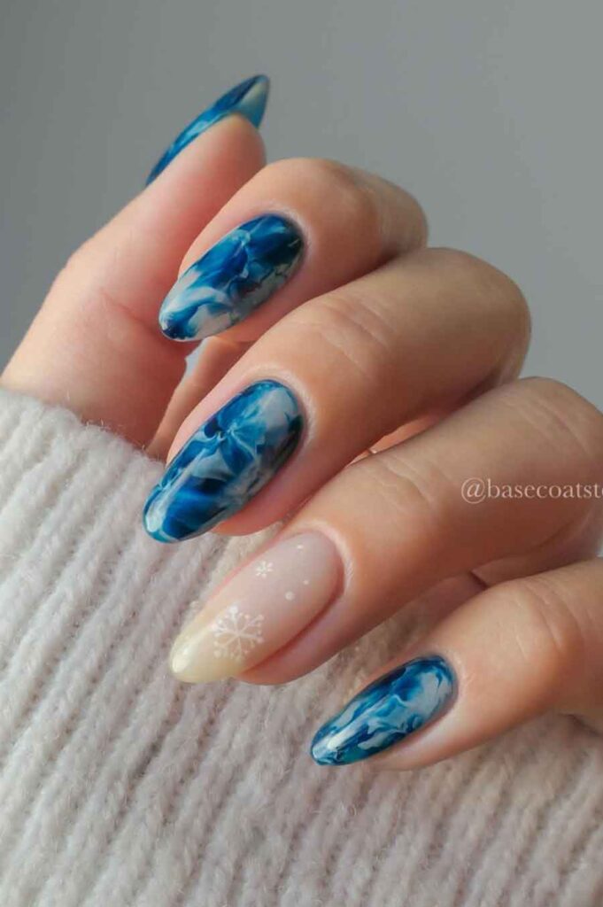 elegant blue nails with snowflake design for the perfect Elsa in winter wonderland aesthetic costume