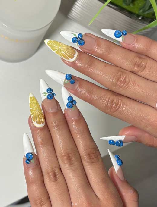 long white tips nails with 3d blueberries