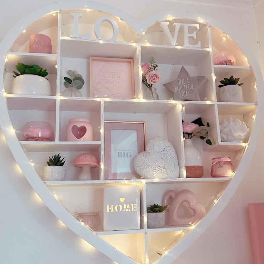 pink aesthetic and girly shelf decor with fairy lights