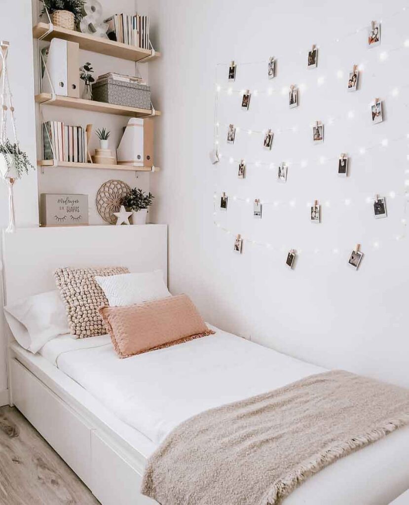 minimal photo clips with fairy light decor in minimalist bedroom