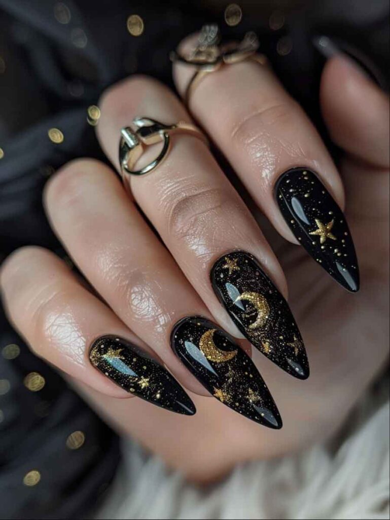black and gold witchy celestial nails with moon and stars