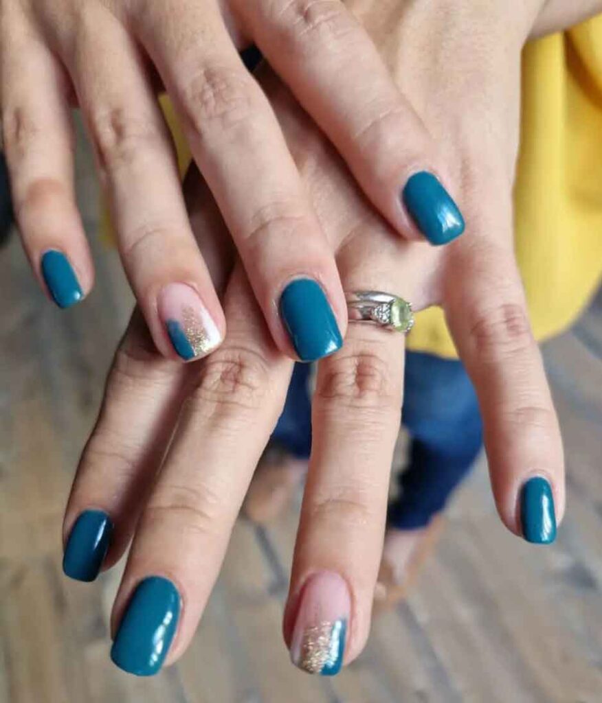 teal nails with gold