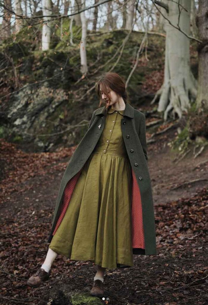 fall cottagecore outfit with olive green dress green and trench coat