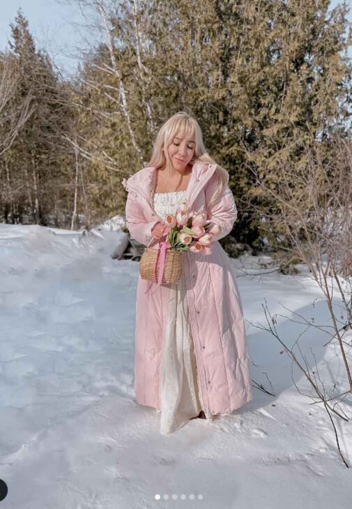 aesthetic vintage winter outfit with long light pink coat