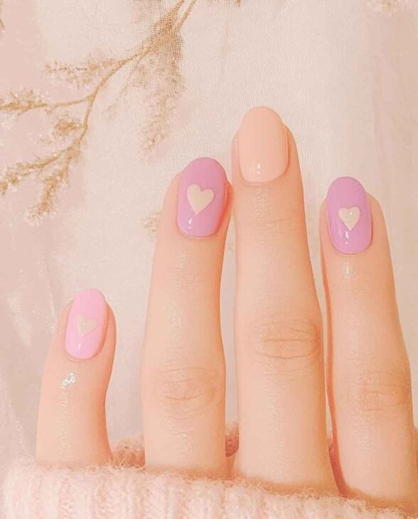 cute pastel peach and purple simple nails for valentines day