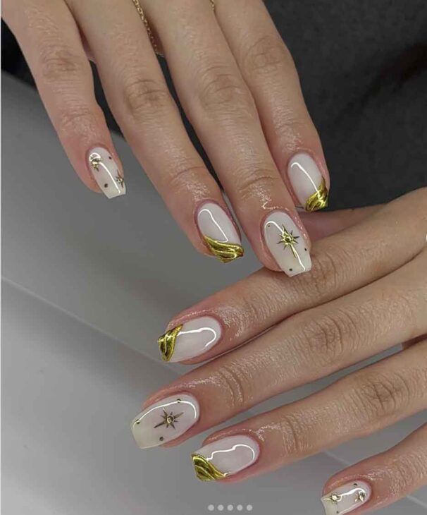 milky white and gold chic christmas nails