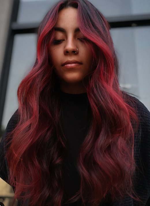 red balayage on brunette hair, witchy aesthetic.