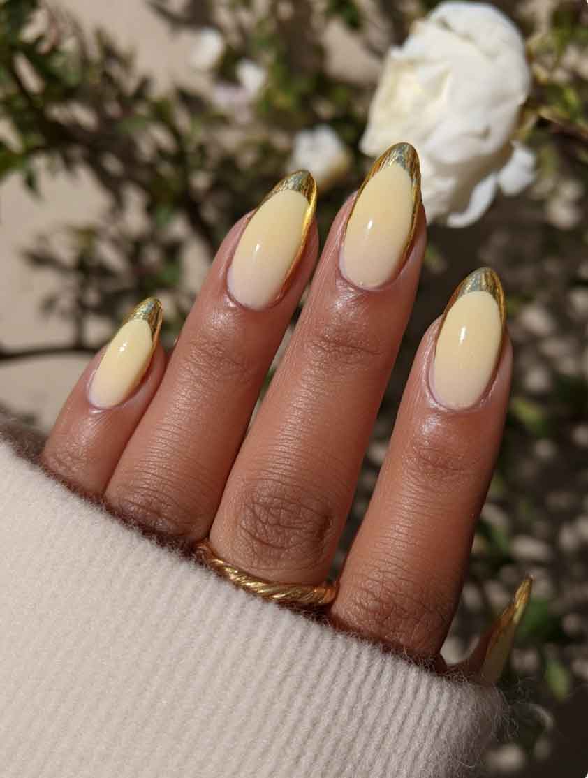 round butter yellow nails with gold tips